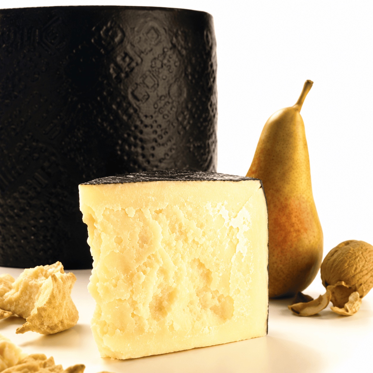 A wheel of Pecorino Romano cut into wedges